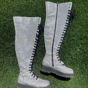 Dolls Kill poster girl over the knee boot